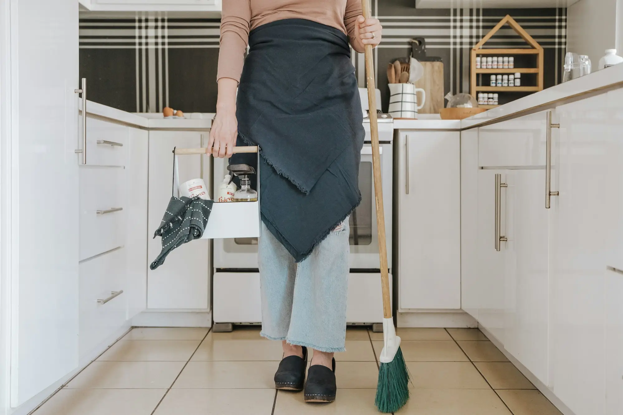 Home support worker in a client's kitchen with cleaning equipment, the kind of in-home service providers claim for after delivery
